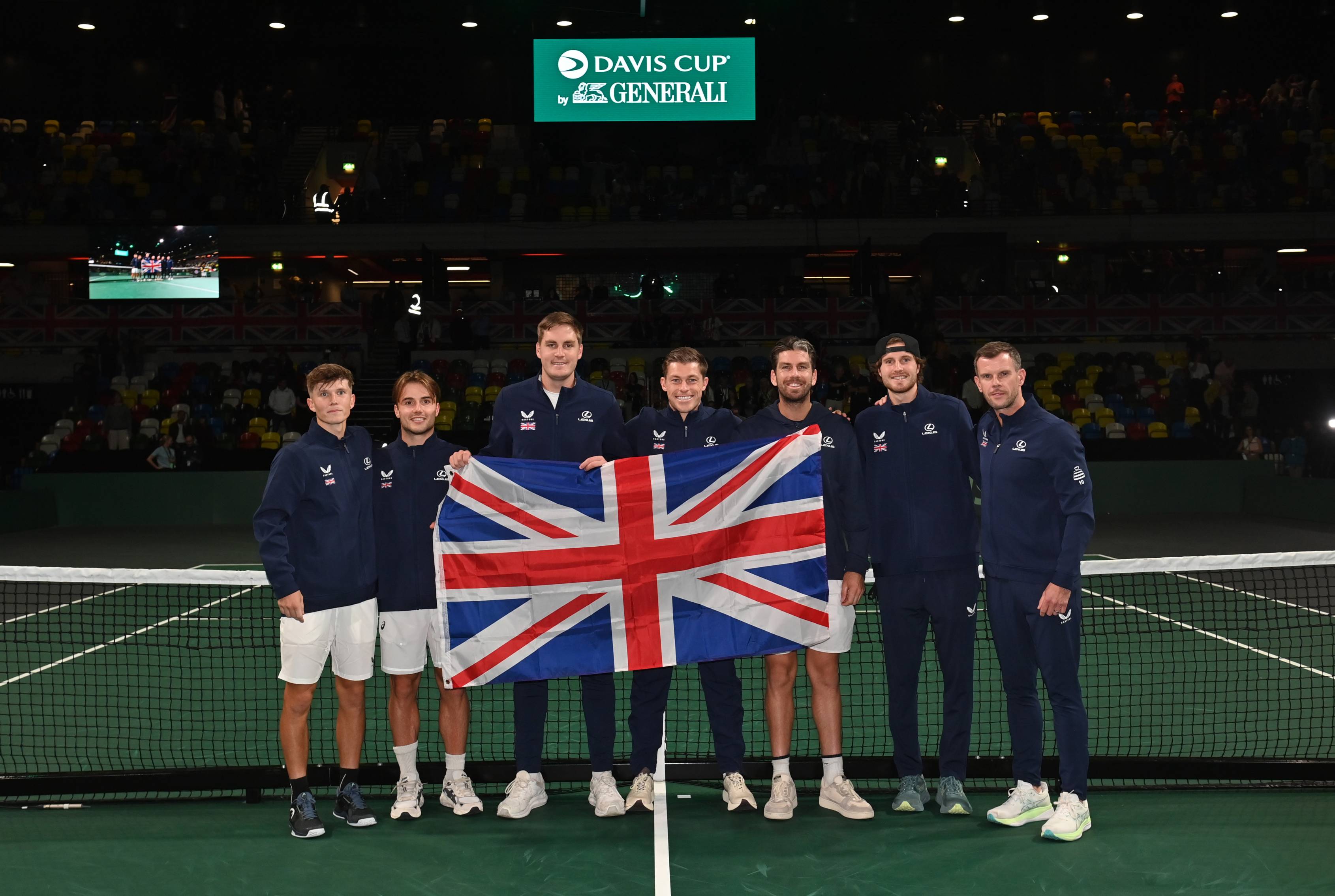 The Lexus Great Britain Davis Cup team hold the GB flag after a win over Ecuador