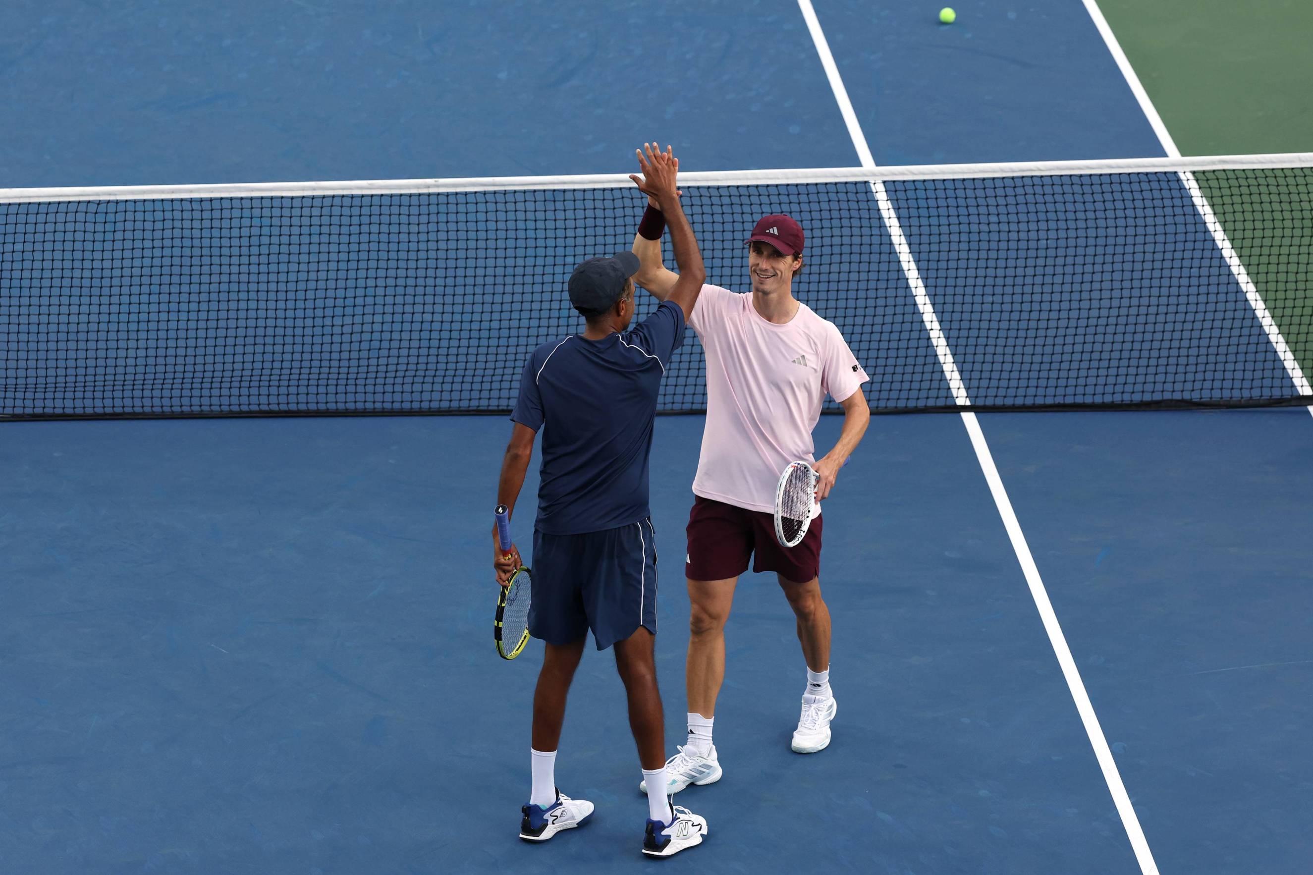Rajeev Ram and Joe Salisbury high five in a quarter-final win at the 2026 US Open