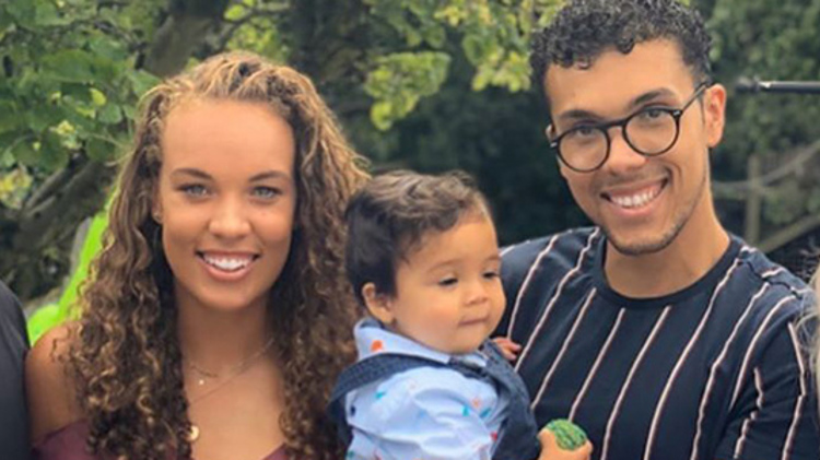 freya cristie with her two brothers, one holding a child and mum on the right