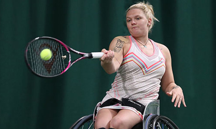Wheelchair women tennis player Jordanne Whiley playing a forehand shot