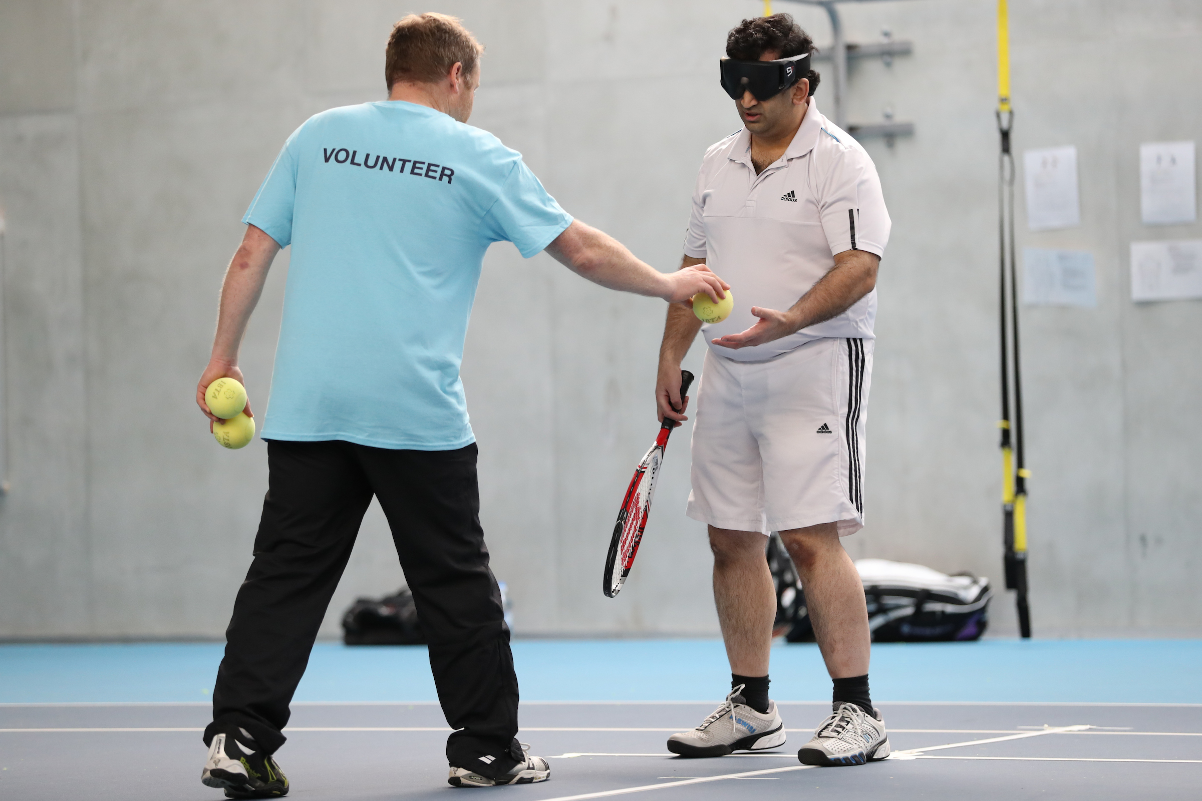 Volunteer playing with Visually impaired player