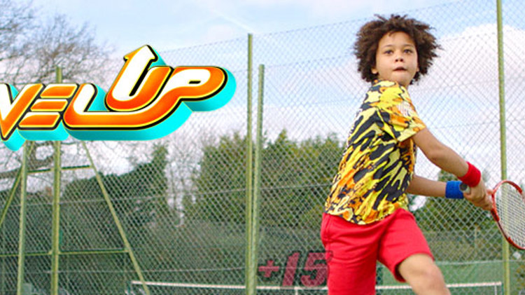 Child playing tennis with level up logo in picture