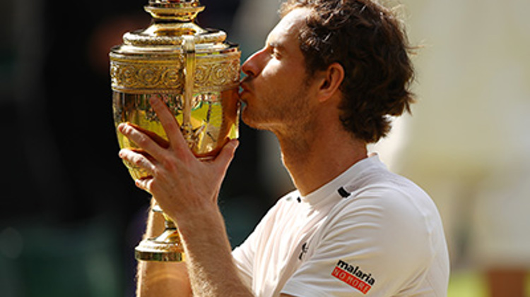 Andy Murray kissing his trophy after winning Wimbledon in 2016