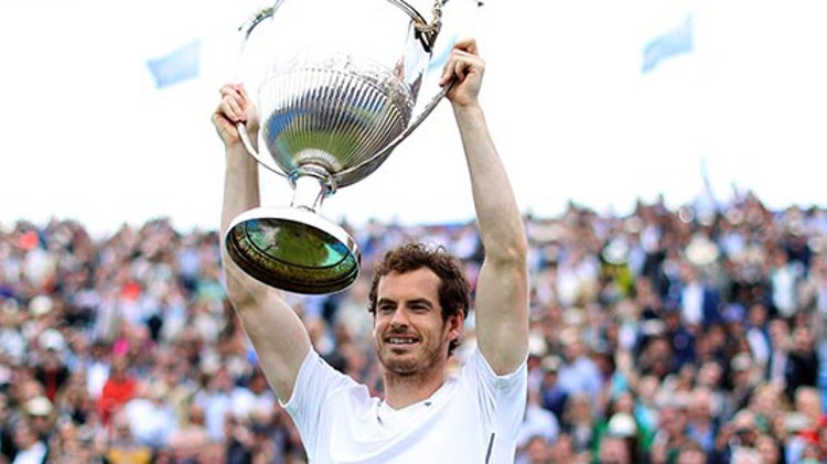 Andy Murray lifting a trophy after winning the men's final at Queens in 2016