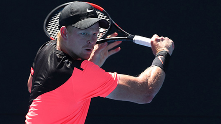 Kyle Edmund playing a backhand shot at the 2018 Australian Open