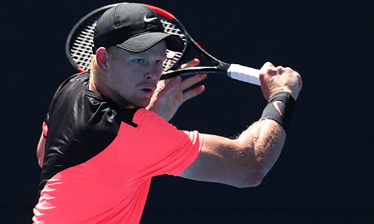 Kyle Edmund playing a backhand shot at the 2018 Australian Open