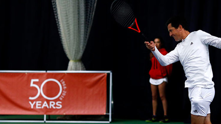 Tim Henman plays at the Open Era 50th Anniversary celebrations at the West Hants Club