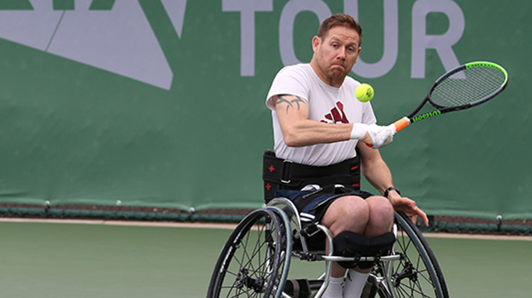 antony cotterill about to hit a ball coming towards him at lta torunamet