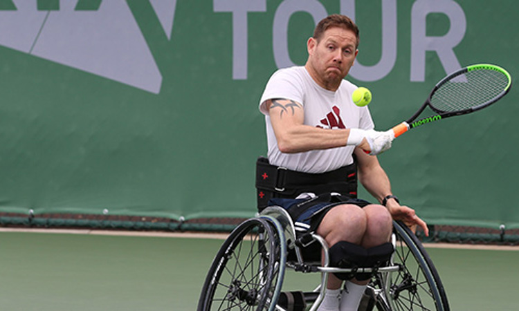 antony cotterill about to hit a ball coming towards him at lta torunamet
