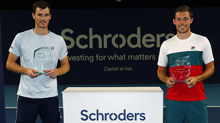 Jamie Murray and Neal Skupski holding their awards