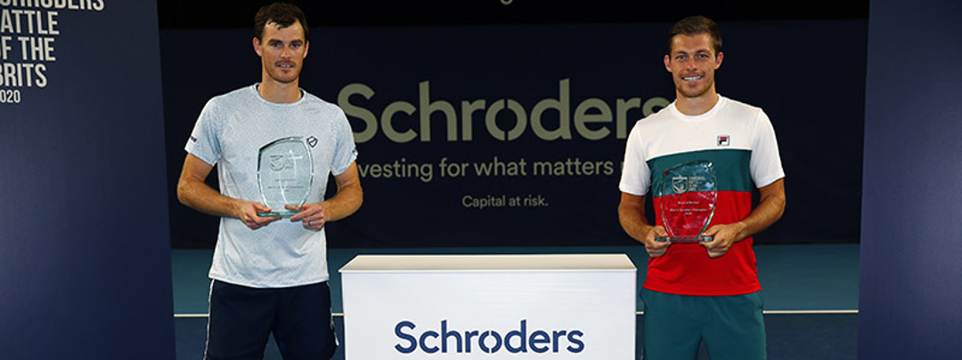 Jamie Murray and Neal Skupski holding their awards