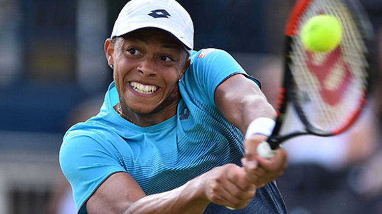 Jay Clarke playing a two-handed backhand