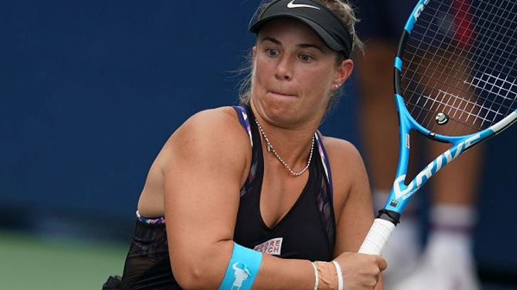close up of Lucy Shuker hitting a backhand