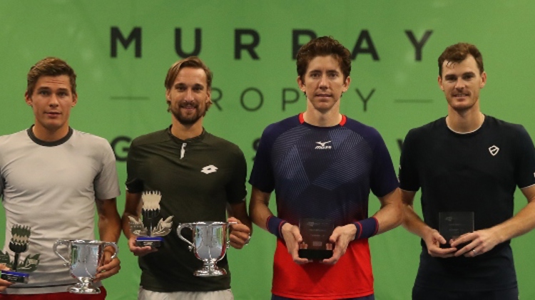 jamie murray and three other players holding trophies in hand in front of murray trophy sign