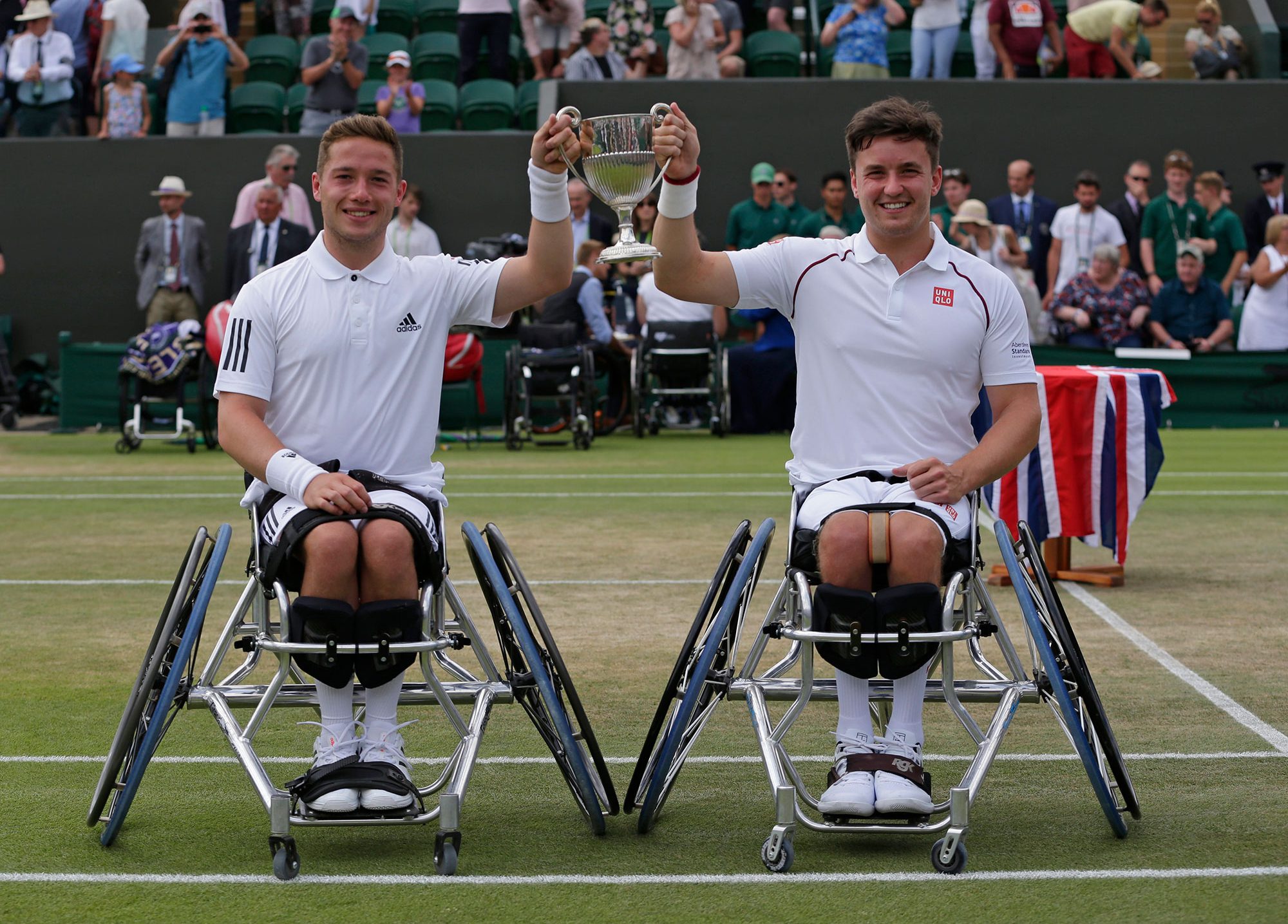 Hewett and Reid holding up their trophy