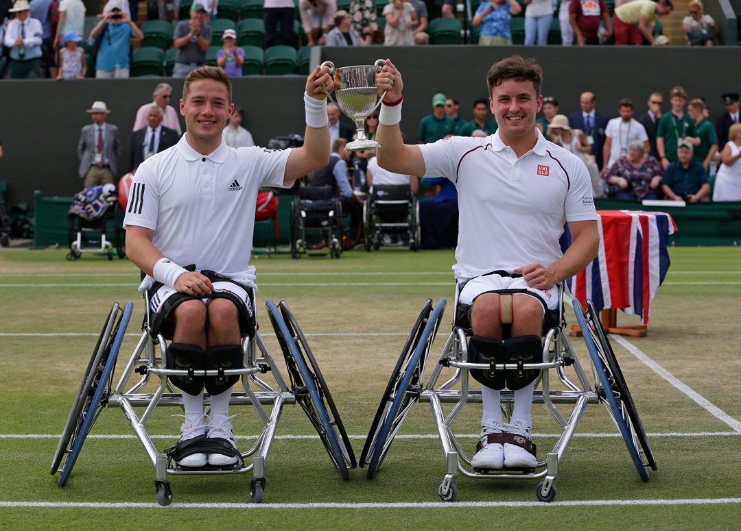 Hewett and Reid holding up their trophy