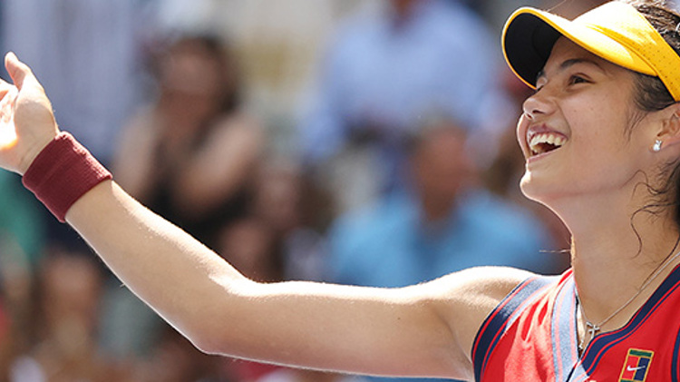 close up of emma raducanu smiling and waving hand out