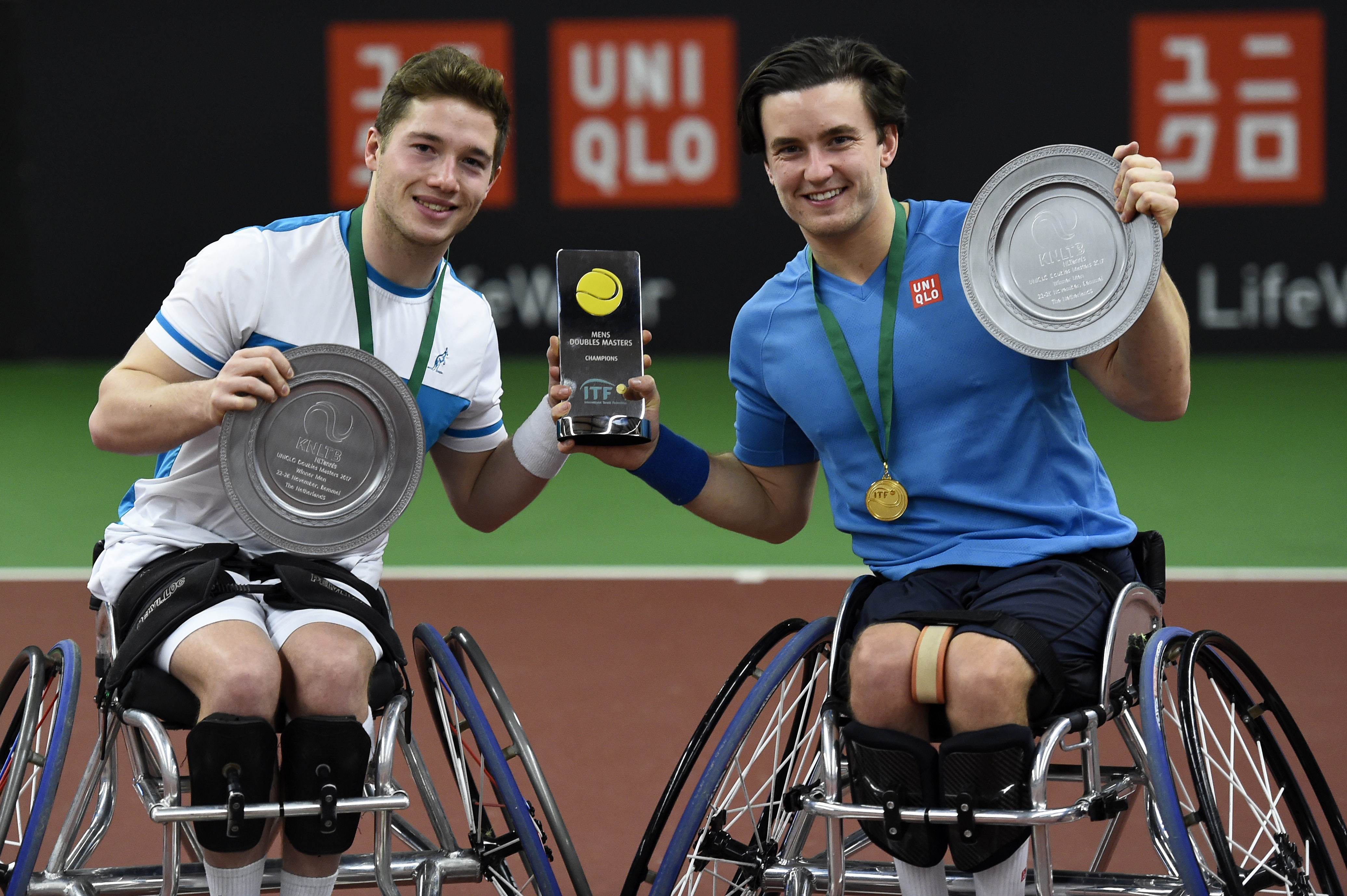 Alfie Hewett and Gordon Reid pose with their Doubles Masters trophies in 2017
