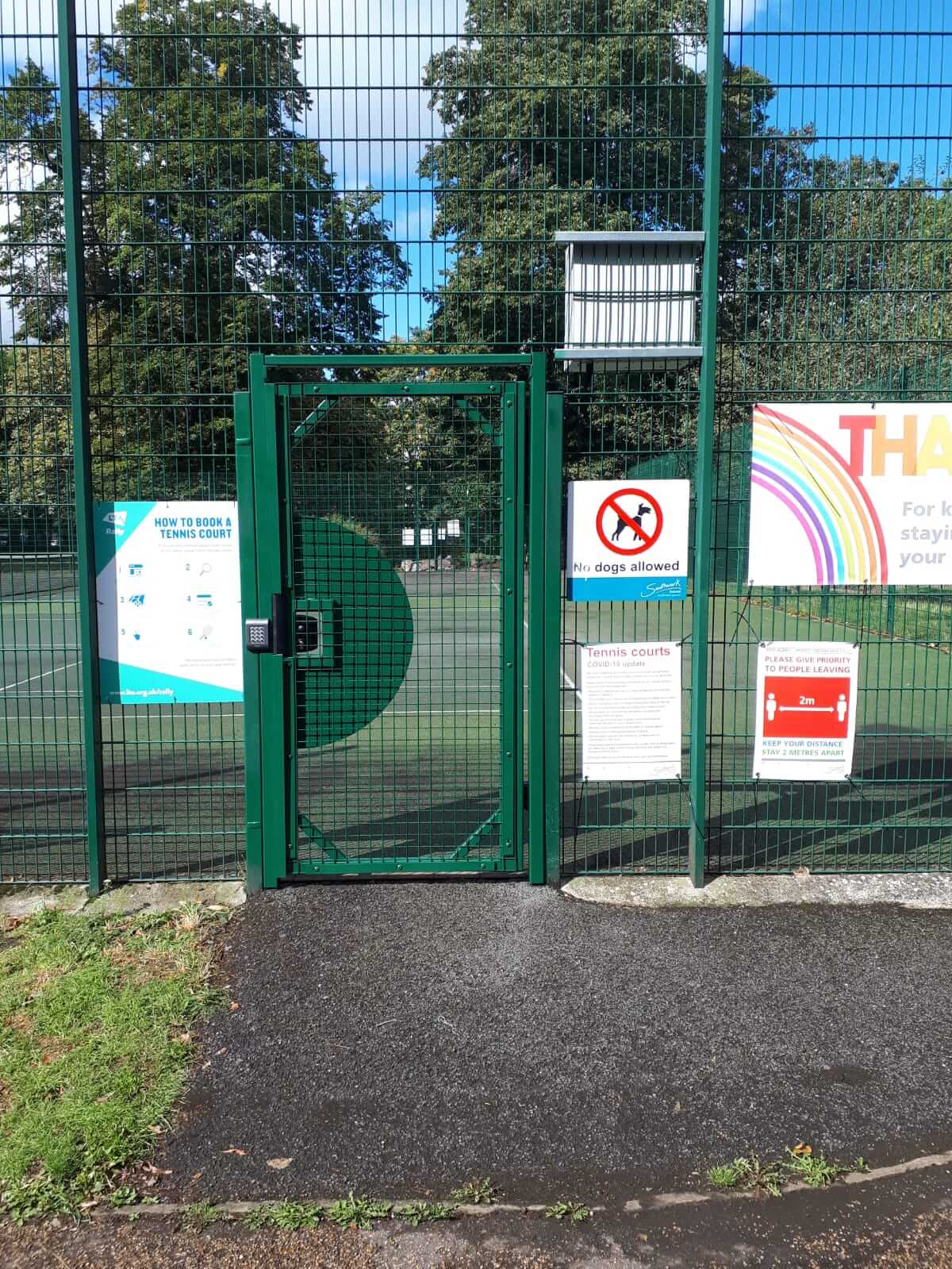 Outdoor view of tennis court gates.jpg