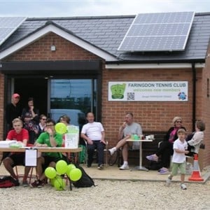 Members of Farringdon tennis club sitting outside their clubhouse